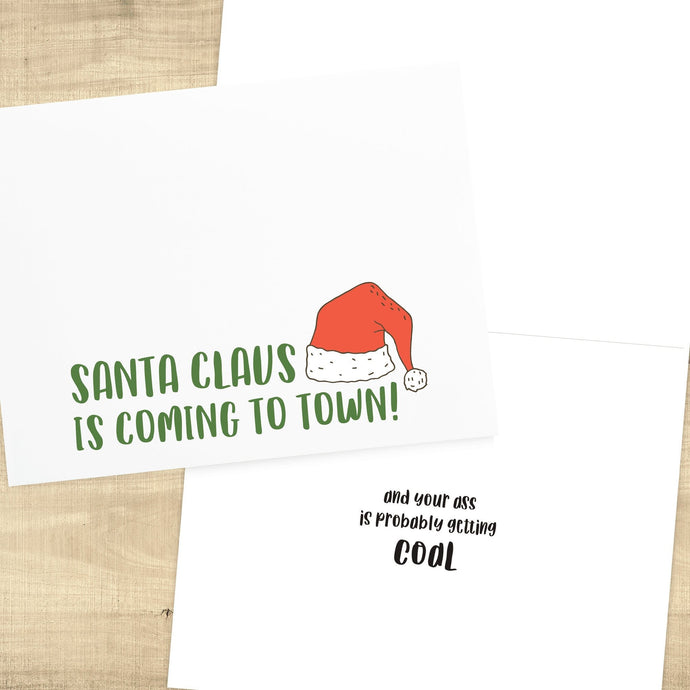 green text with red santa hat on white background