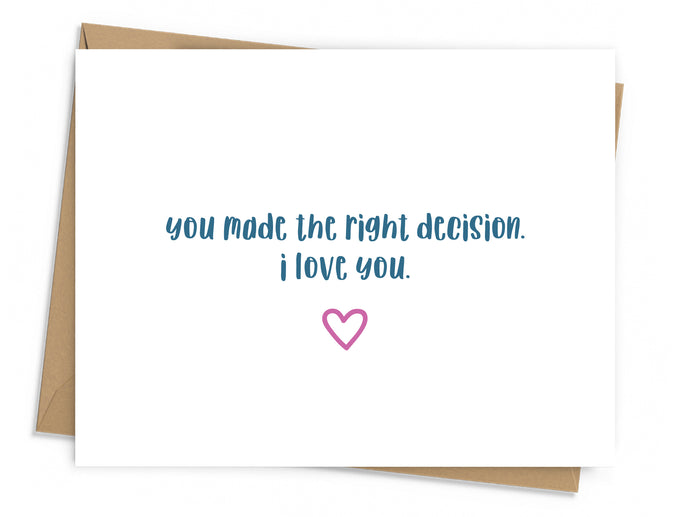 card with blue text with small pink heart underneath